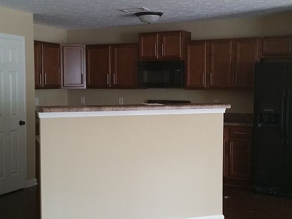 Open Kitchen, Black Appliances, Side by Side Fridge