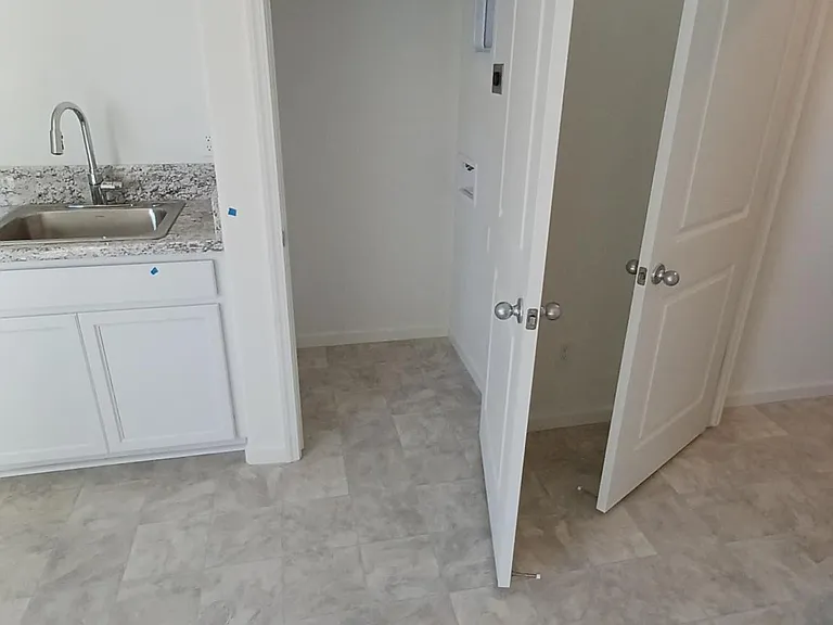 Photo of laundry area taken before furnishing