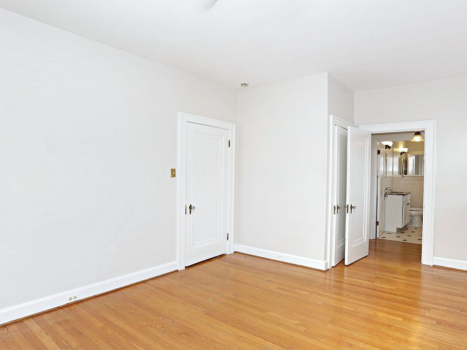 This is another picture of the bedroom that leads into the bathroom. The first door on the left goes into the living room. The bump out is a closet. Then you move thru the other door into the dressing area and finally the bathroom.