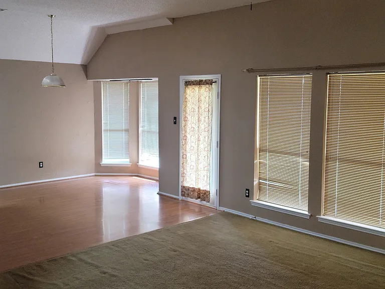 Living room looking into breakfast nook/backdoor