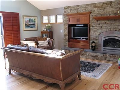 The spacious Great Room offers this beautiful living room area with fireplace,