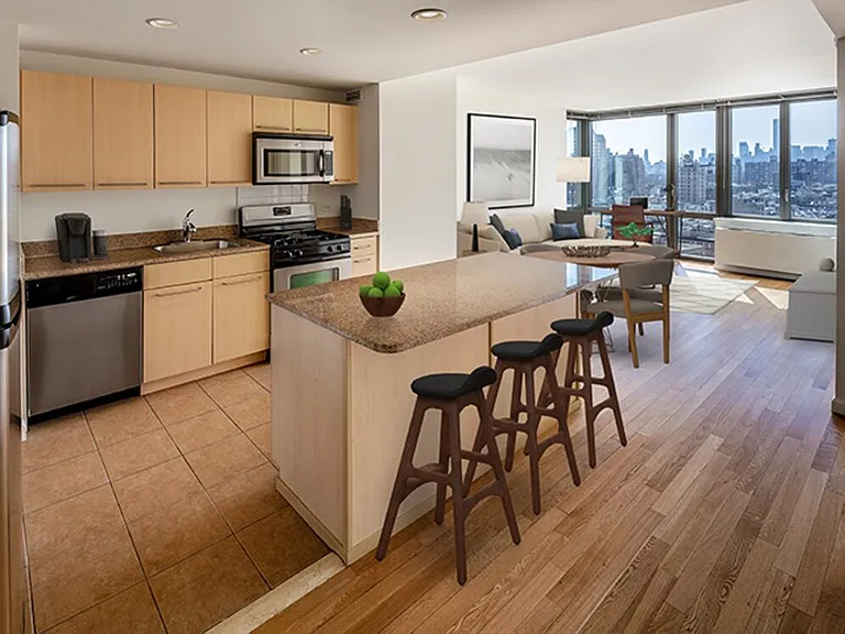 Classic Package I kitchen with beige speckled countertops, beige cabinets, stainless steel appliances, and hard surface flooring