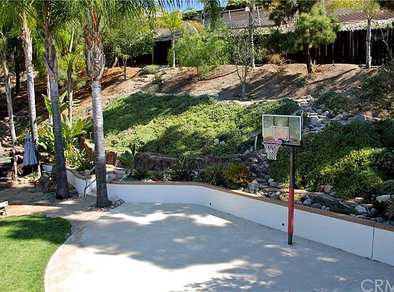 A half basketball court, a slope with meandering trails and gardens, fountains and rivers!