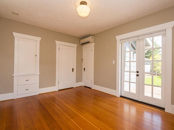 Bedroom with French doors to back deck.