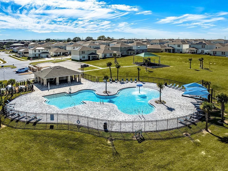 Resort-style pool with splash feature, cabana, and plenty of room to unwind.