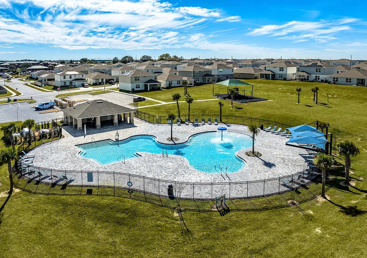 Resort-style pool with splash feature, cabana, and plenty of room to unwind. - Cedar Ridge