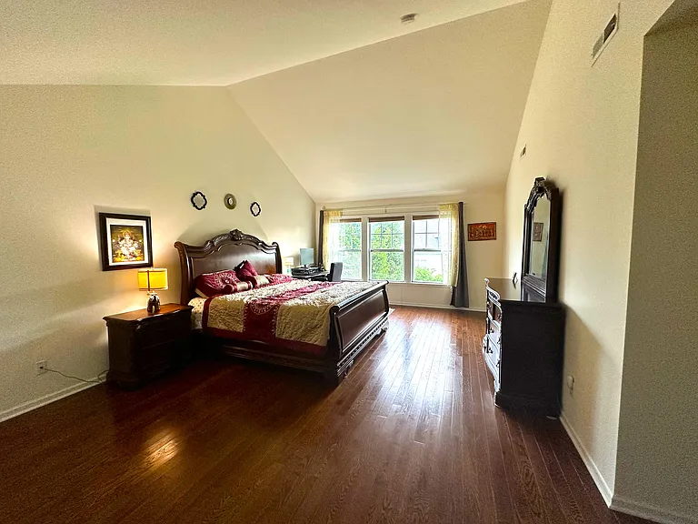 Master bedroom with high ceiling