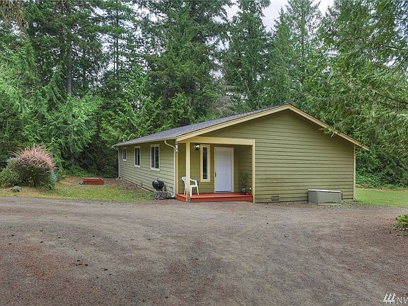 Flat sunny acre surrounded by NW beautiful trees