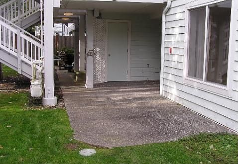 spacious deck that is partially covered.