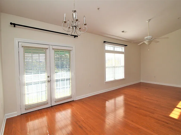 Living room, dining area with beautiful wooded view