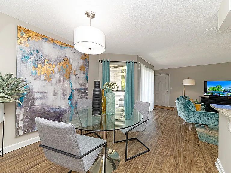 Dining area with hardwood-style flooring & built-in lighting