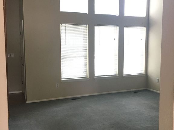Dining room with large windows and vaulted ceilings