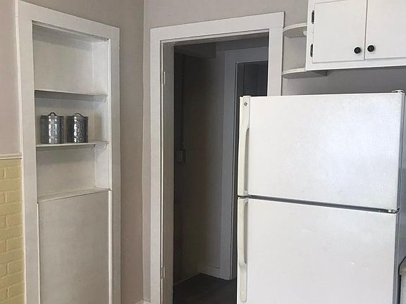Kitchen looking into living room area