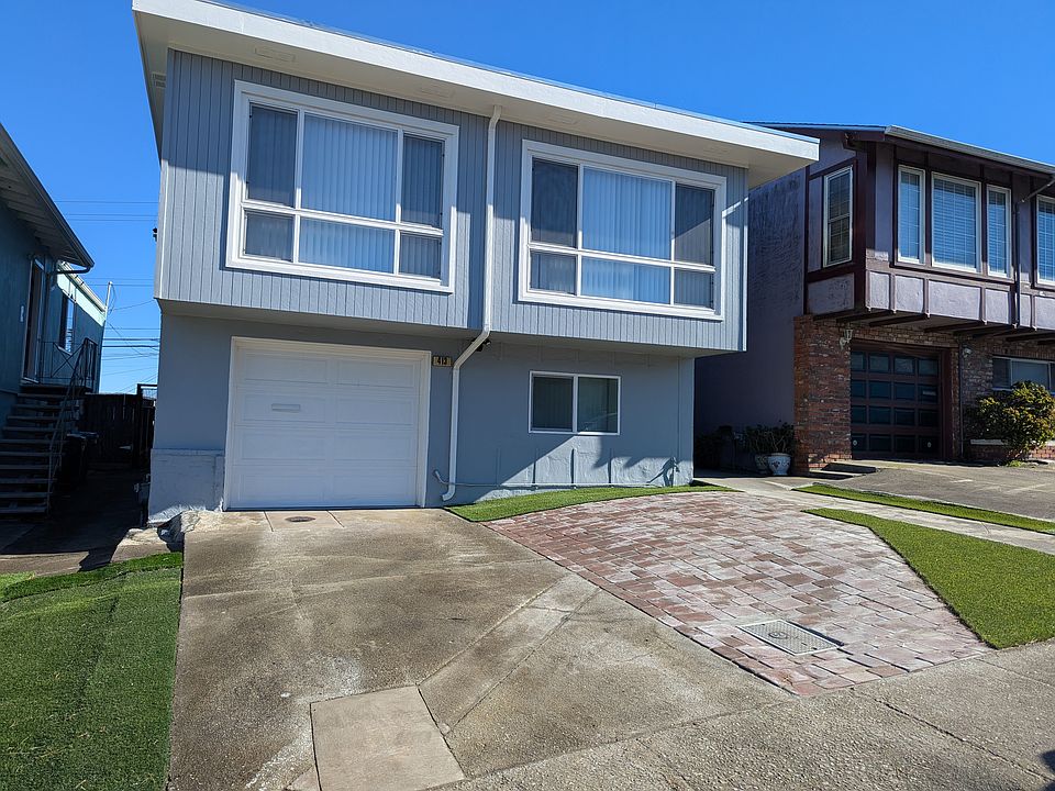 Front yard with 2 separate parking spots