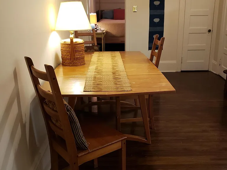 Dining area looking into bedroom