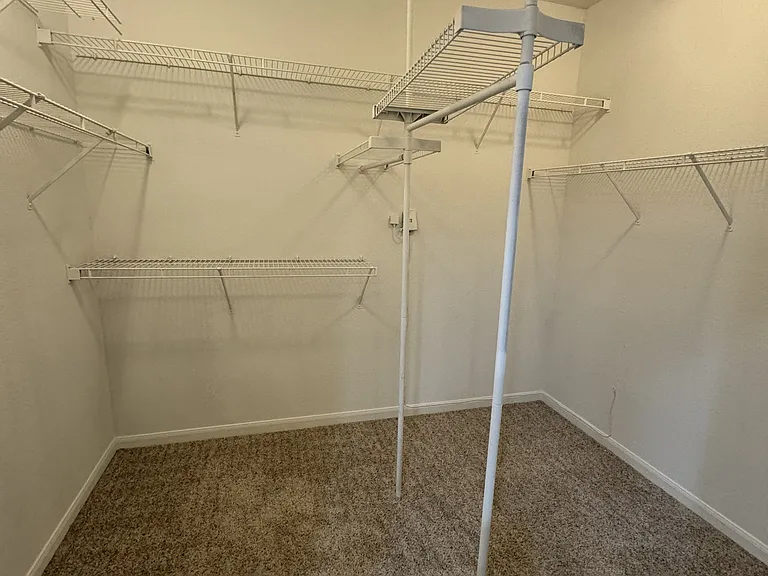 Spacious Primary Closet Spacious Primary Closet