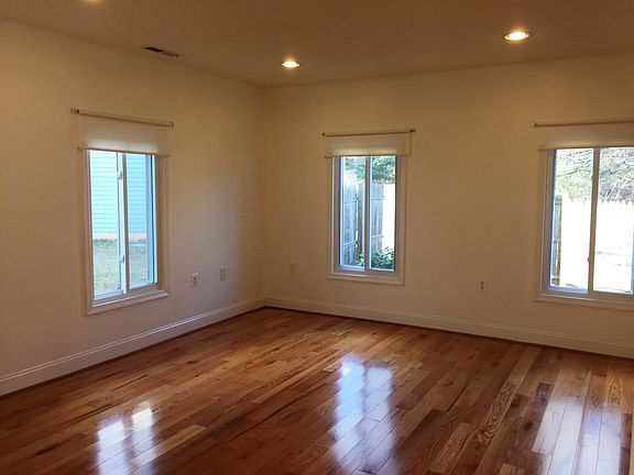 Sun filled living room with recessed lights