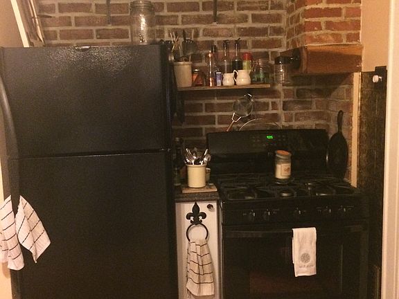 Kitchen with exposed brick