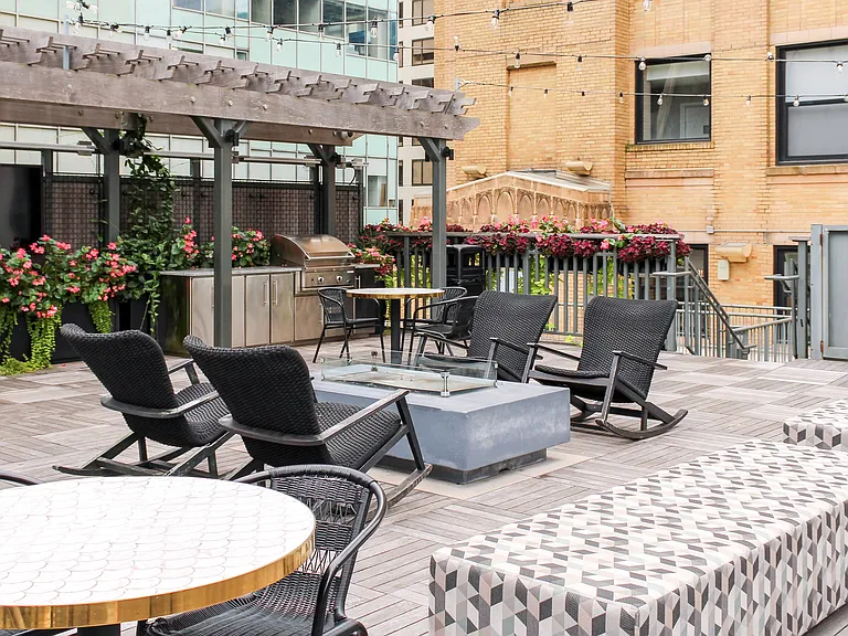 Rooftop with seating, fireplace, and grills