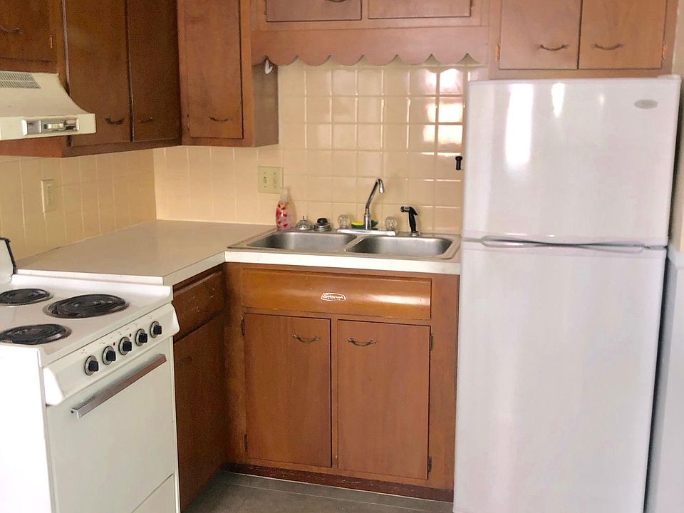 Compact, clean kitchen and modern amenities. Warm, cozy apartment.