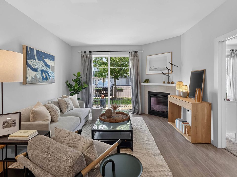 A cozy gas fireplace brings warmth to the living room.