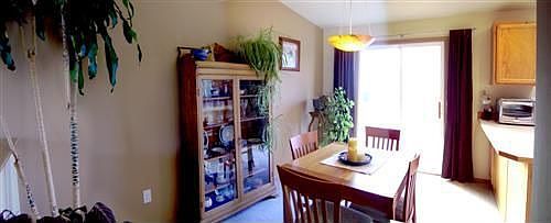 Dining room with slider to back deck and overlooks living room