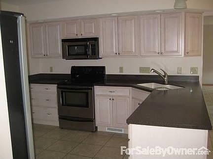 Kitchen
						:
						Stainless steel self-cleaning oven and microwave; brushed nickel faucet