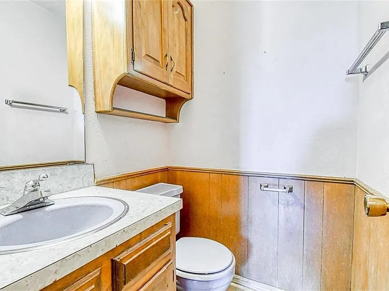 Half bathroom near kitchen