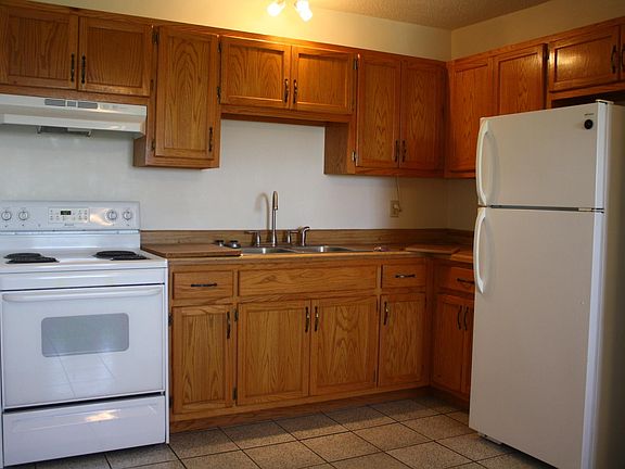 All wood cabinets with oak doors
Full size stove and refrigerator