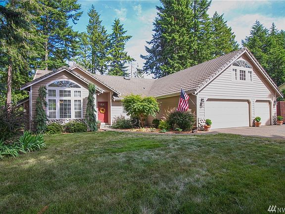 3 car garage and fresh landscaping 