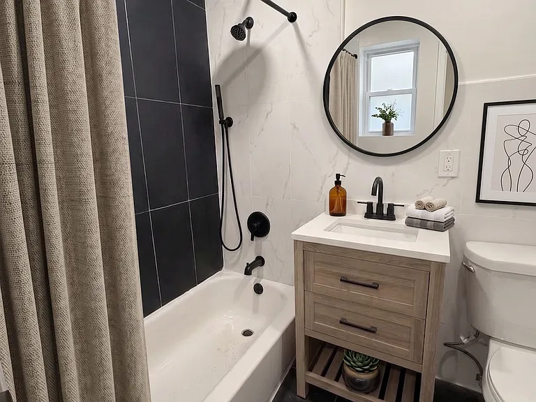 Bathroom- This room has been virtually staged using AI to help visualize its layout and design potential.