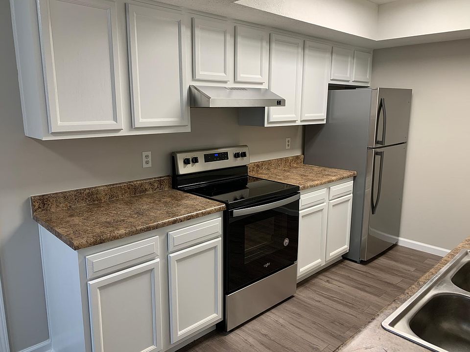 Kitchen stove and refrigerator wall.