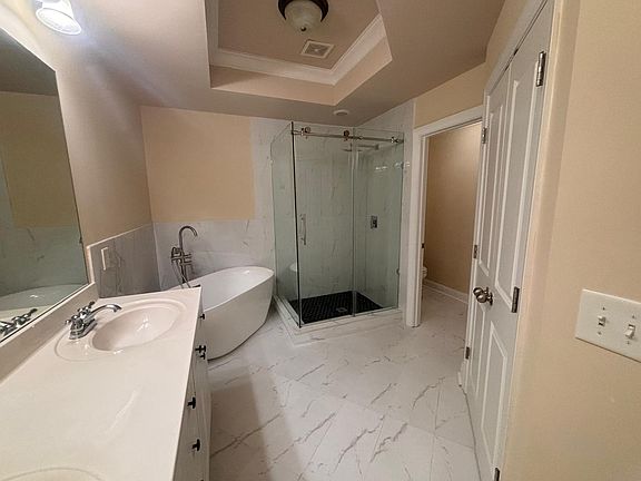 Newly renovated Mater Bath with free standing tub and Glass enclosed shower