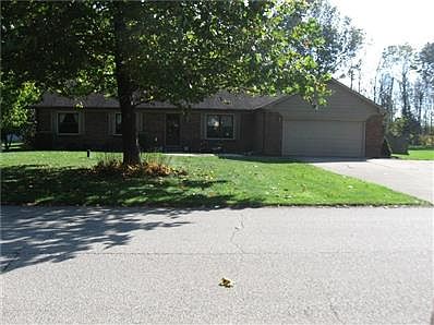 Beautiful front yard with mature trees.