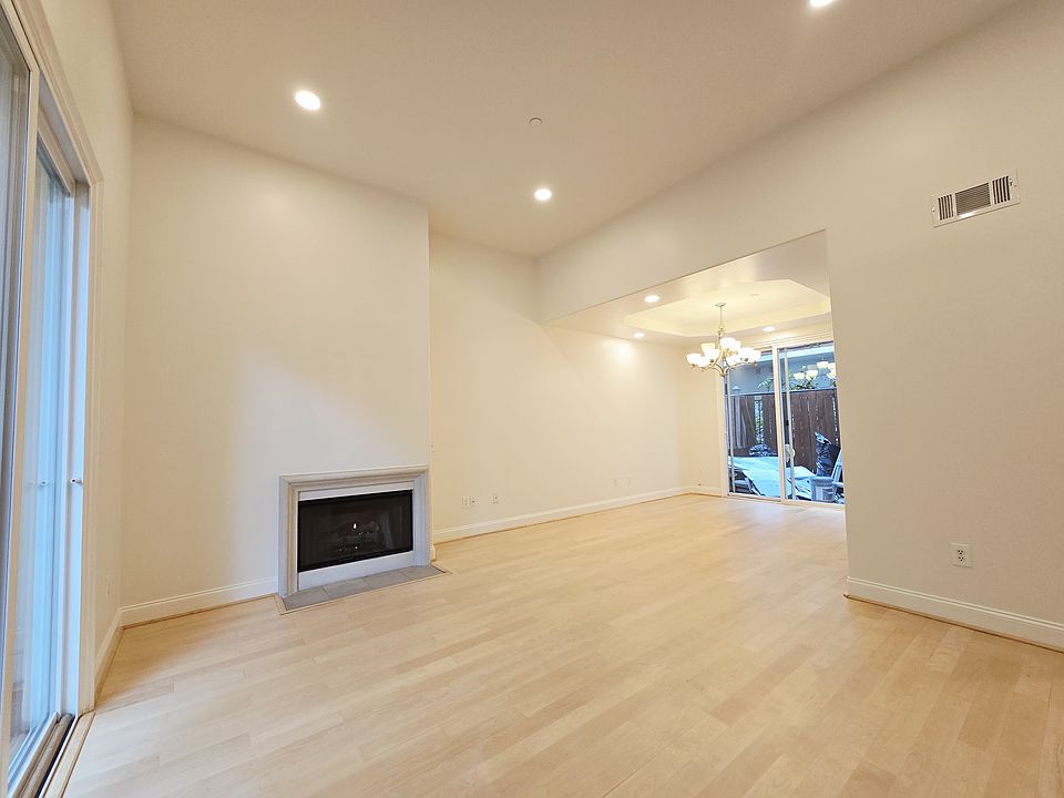 High Ceiling Living Room with a Fireplace