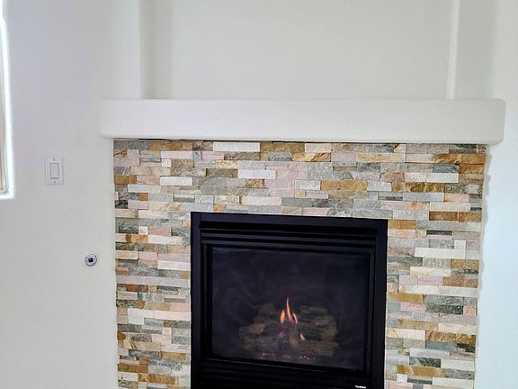 Stacked stone gas fireplace