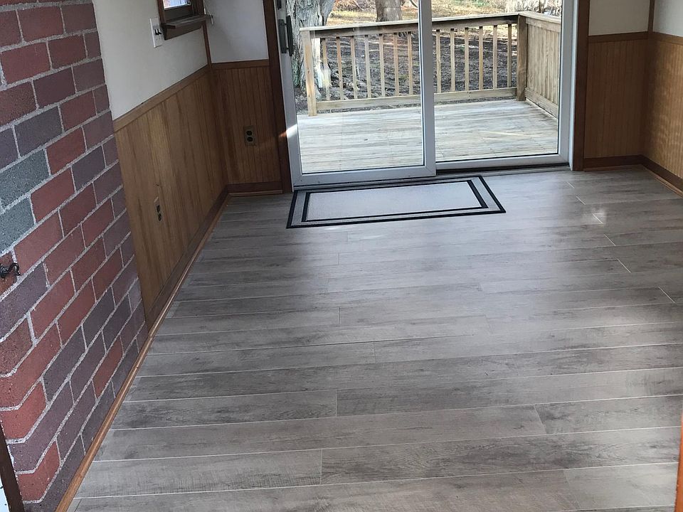New flooring in bonus room (overlooking deck & large back yard).