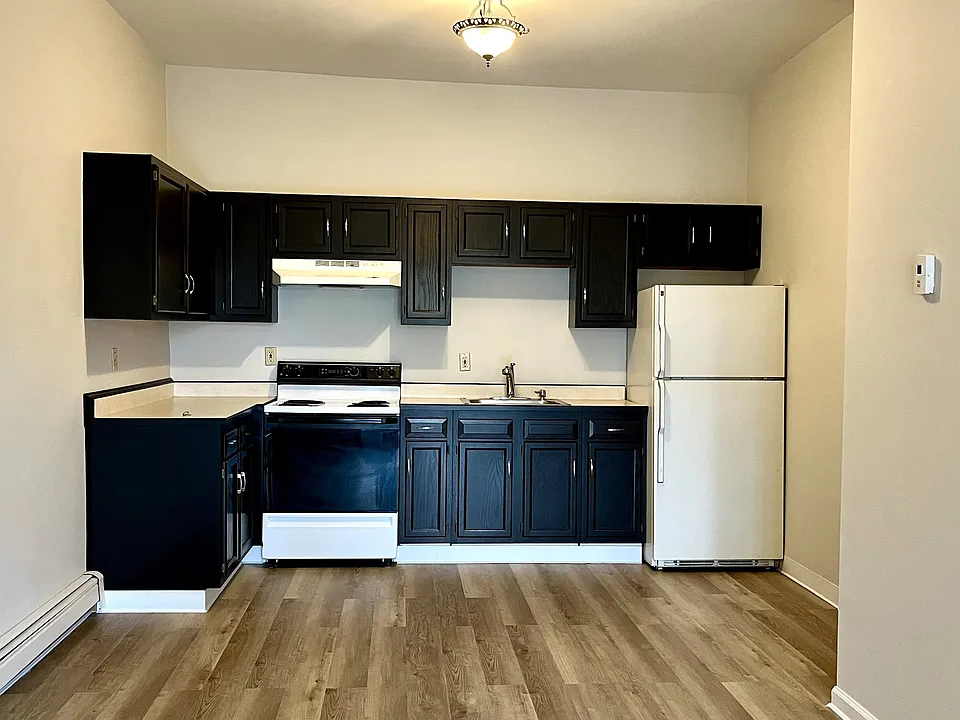 Large kitchen area with lots of storage and seating space