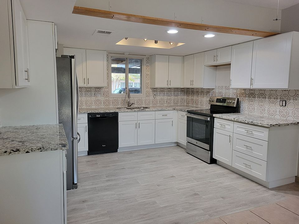 New white shaker cabinets. Self-closing. Open concept.