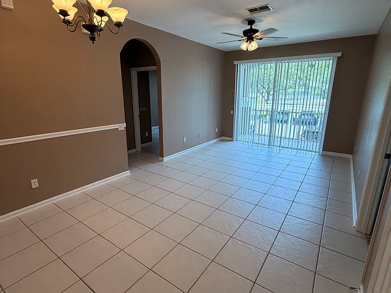 Tile throughout with updated light fixtures and fans. Screened balcony through dual sliding glass doors.