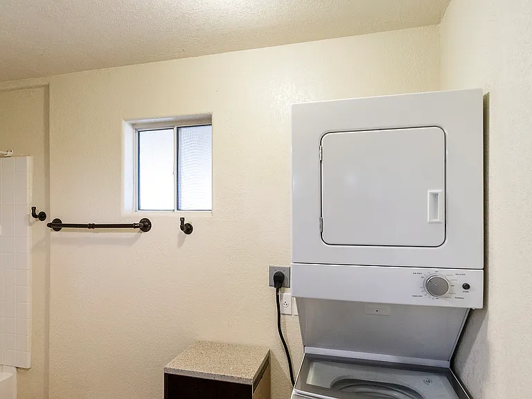 STACK WASHER / DRYER IN MAIN BATHROOM