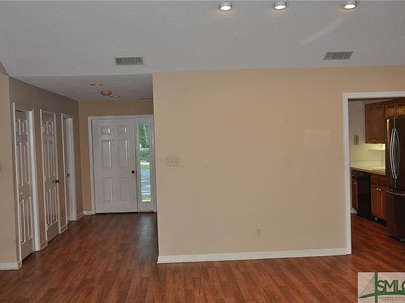 Living Room opens to the Foyer and the Kitchen