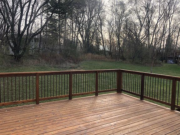 Back deck with access from upstairs and downstairs