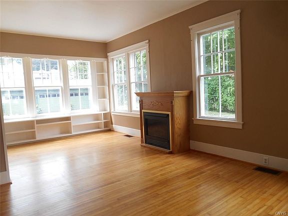 Formal living room with gas fireplace and plenty of natural light...