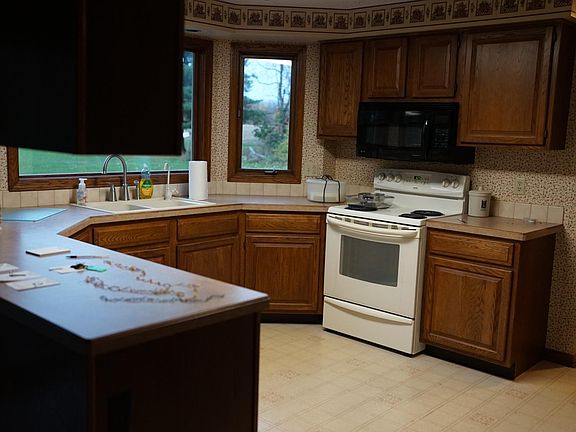 Kitchen with electric stove, dishwasher, refrigerator, and microwave included!