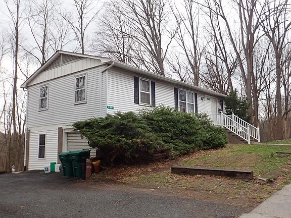Front corner showing driveway