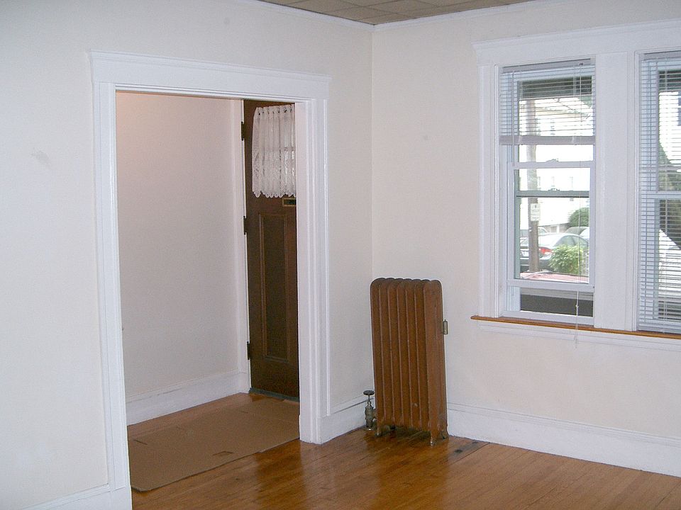 Entry hall and living room front corner (A & D sides)