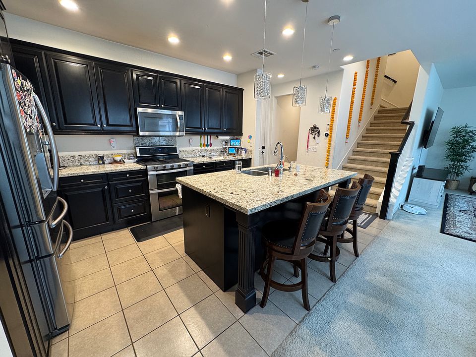 Kitchen with Espresso Cabinets and Granite Countertops