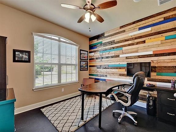 Custom inlaid wood and wall clock make this office space so eye catching and vibrant!