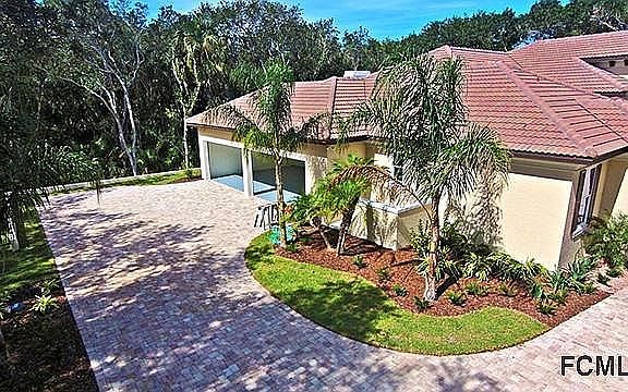 Paver Driveway leading to 4-Car Garage